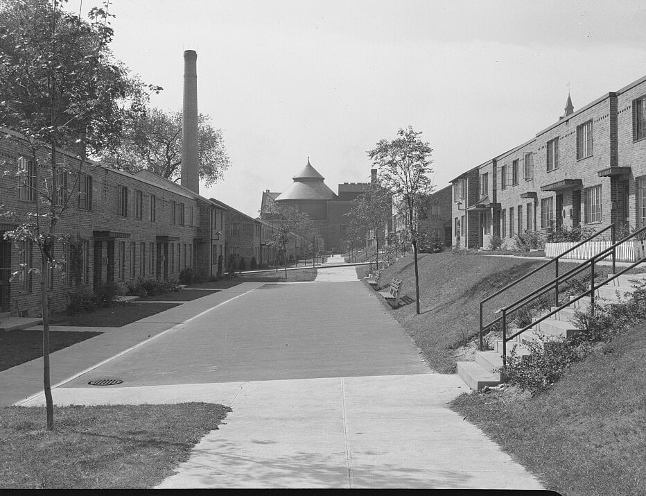photograph of rows of new, 2-story housing and sidewalks.
